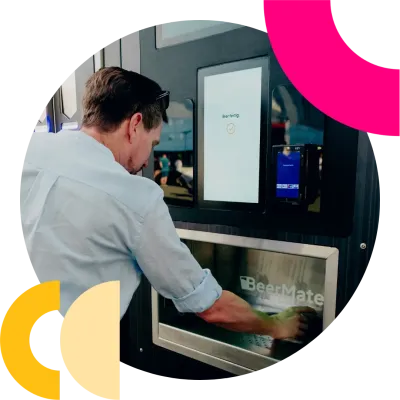 Guy grabbing beer at BeerMate machine