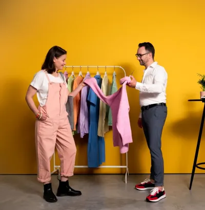 A customer is advised in a clothes shop