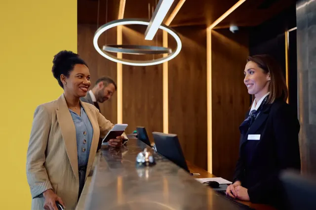 Two woman at hotel reception